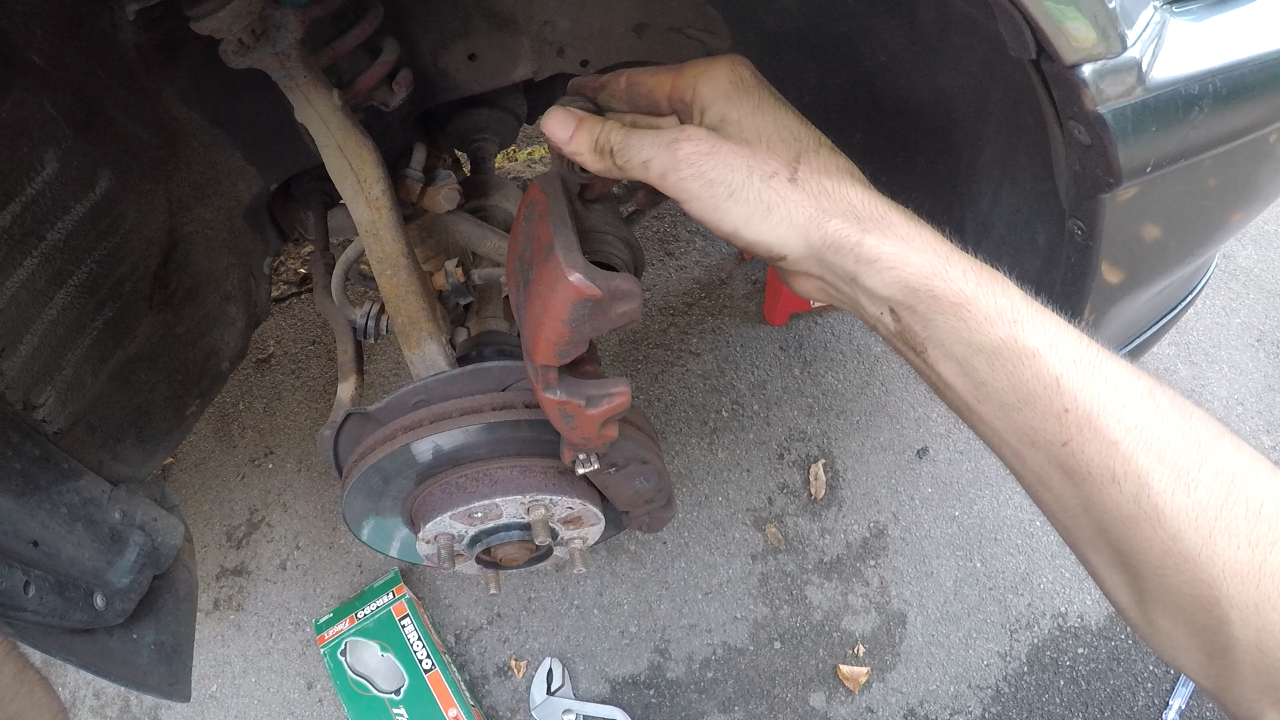 Swivelling the caliper up to release the brake pads on the Honda Civic EF, CRX & Shuttle